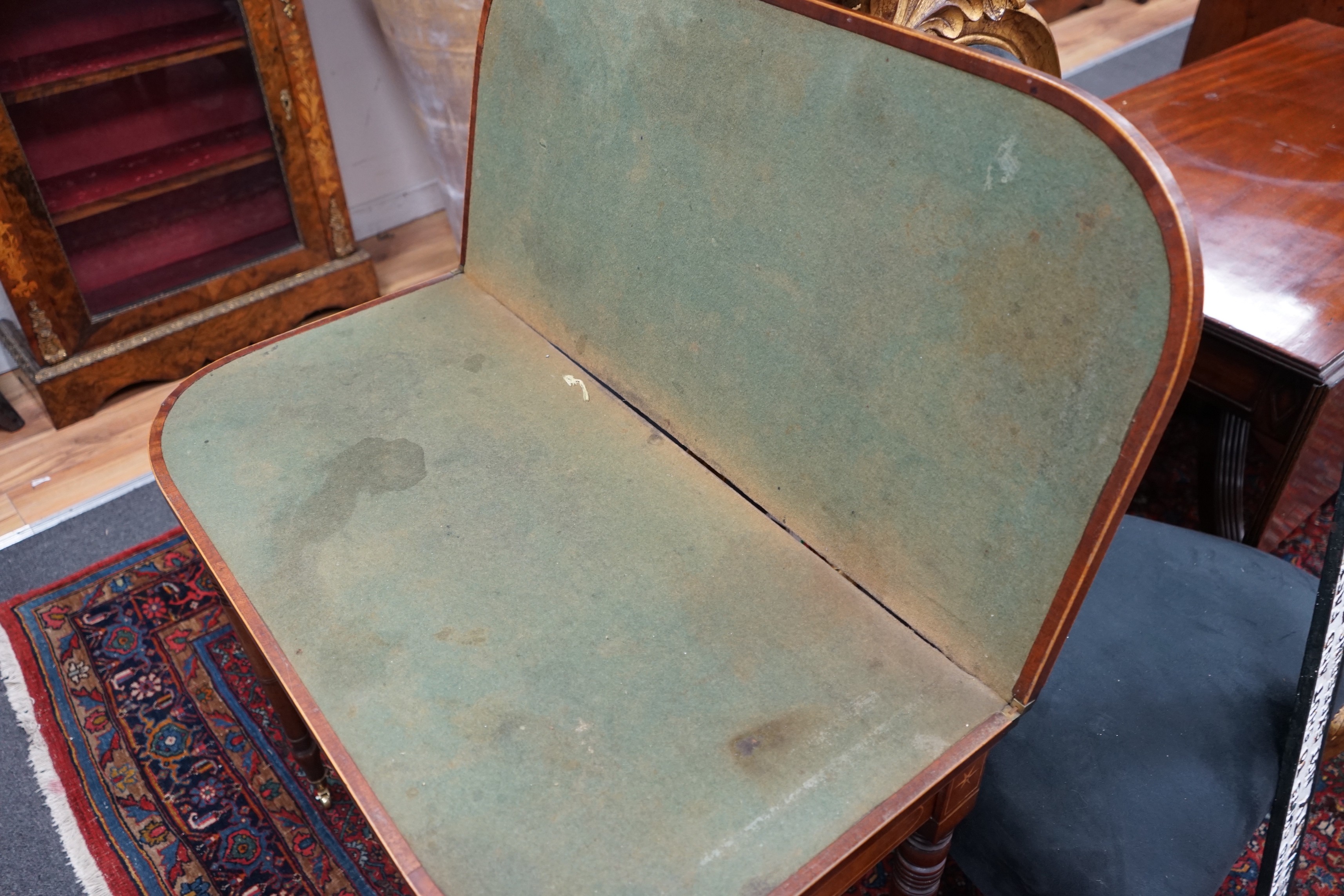 A Regency banded and inlaid mahogany D shaped folding card table, width 91cm, depth 45cm, height 70cm